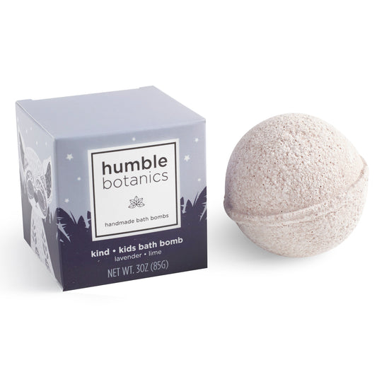 A single KIDS Kind Bath Bomb and its blue "Humble Botanics" box, showcasing a natural lavender and lime kids bath bomb on a white background.