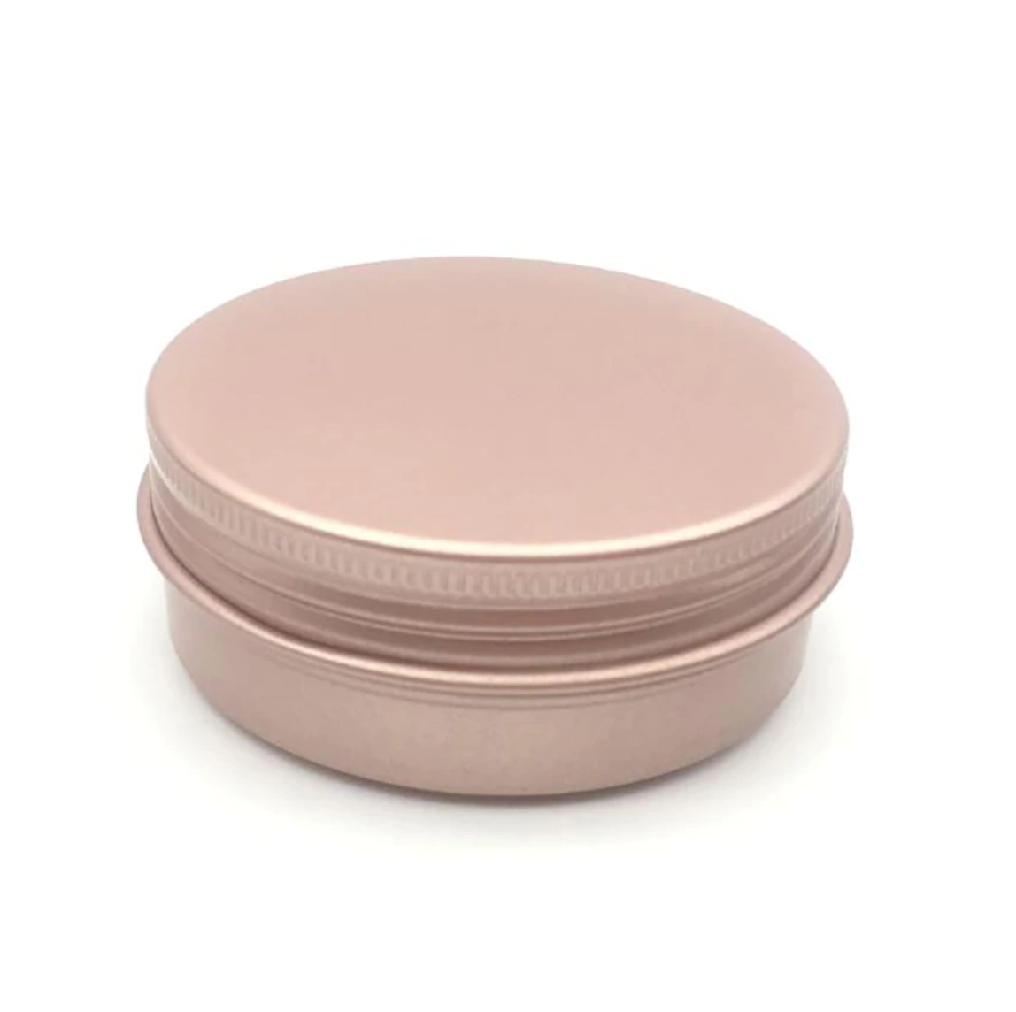 A rose gold colored shampoo bar tin with a screw-top lid, suitable for storing shampoo bars or other bath products.