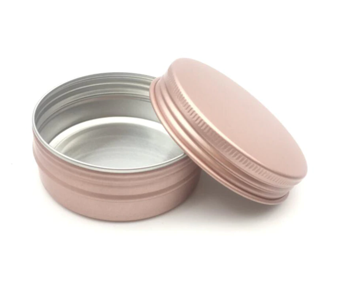 Shampoo bar travel tin against a white background